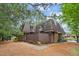 Brick townhouse with two stories, fenced porch, dormer windows, and mature landscaping at 127 Finley Forest Dr, Chapel Hill, NC 27517