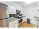Updated kitchen featuring granite counters, stainless appliances, tile backsplash and hardwood floors at 127 Finley Forest Dr, Chapel Hill, NC 27517