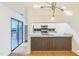 Modern kitchen with stainless steel appliances, hardwood floors, granite counters, and sliding glass doors at 127 Finley Forest Dr, Chapel Hill, NC 27517