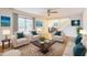 Bright living room features hardwood floors, neutral walls, ceiling fan and glass sliding doors at 127 Finley Forest Dr, Chapel Hill, NC 27517
