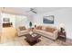 Cozy living room featuring hardwood floors, a neutral sofa and chair set, and a charming staircase at 127 Finley Forest Dr, Chapel Hill, NC 27517