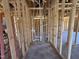 Future bathroom showcasing wood framing and the initial stages of plumbing work installation at 136 Tuskeegee Dr, Smithfield, NC 27577