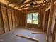 Bedroom under construction shows the framing and structure before the walls are up at 136 Tuskeegee Dr, Smithfield, NC 27577