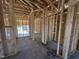 Image of the home during the construction phase, showcasing framed layout of new home at 136 Tuskeegee Dr, Smithfield, NC 27577