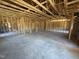 Unfinished living area showcases an open floor plan, framed and ready for personalization and finishing touches at 136 Tuskeegee Dr, Smithfield, NC 27577
