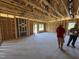Spacious living room under construction shows the framing and structure before the walls are up at 136 Tuskeegee Dr, Smithfield, NC 27577