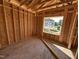 Image of new construction showing framed room and neighborhood view at 136 Tuskeegee Dr, Smithfield, NC 27577
