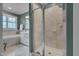 Bathroom including large shower, soaking tub, and a window with plantation shutters at 137 Cofield Cir, Durham, NC 27707