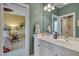 En-suite bathroom including vanity with double sinks and access to a bedroom and shower area at 137 Cofield Cir, Durham, NC 27707