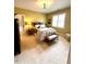 Comfortable bedroom features a plush bed, sitting bench and carpet floors at 137 Cofield Cir, Durham, NC 27707