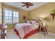 Bedroom including queen bed, ceiling fan, window, and decorative shelving at 137 Cofield Cir, Durham, NC 27707