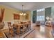 Bright dining area flows into the living room, featuring elegant lighting and classic decor at 137 Cofield Cir, Durham, NC 27707