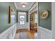 Inviting foyer featuring hardwood floors and detailed wainscoting at 137 Cofield Cir, Durham, NC 27707