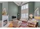 Cozy living room with a fireplace and soaring windows at 137 Cofield Cir, Durham, NC 27707