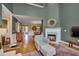 Inviting living room boasts a fireplace, high ceilings, and hardwood floors, seamlessly blending comfort and style at 137 Cofield Cir, Durham, NC 27707