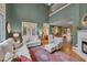 Open-concept living room featuring a fireplace and hardwood floors at 137 Cofield Cir, Durham, NC 27707
