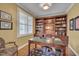 Elegant office space with custom built-in bookshelves and a classic desk at 137 Cofield Cir, Durham, NC 27707