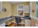 Comfortable office space featuring a granite countertop and window to another room at 137 Cofield Cir, Durham, NC 27707