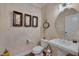 Stylish powder room with a pedestal sink and decorative wall accents at 137 Cofield Cir, Durham, NC 27707