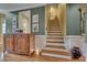 Open staircase with hardwood steps and white risers providing a seamless transition between floors at 137 Cofield Cir, Durham, NC 27707