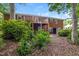 Backyard featuring a deck, brick siding, and lush greenery at 1405 Kenbrook Dr, Garner, NC 27529