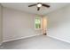Bedroom featuring neutral paint, carpeted floors, ceiling fan, and a view to the hallway at 1405 Kenbrook Dr, Garner, NC 27529