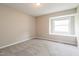 Bedroom featuring neutral paint, carpeted floors, and a window with natural light at 1405 Kenbrook Dr, Garner, NC 27529