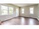Bright living room with wood-look flooring, neutral walls and abundant natural light at 1405 Kenbrook Dr, Garner, NC 27529