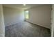 Bedroom with neutral carpeting, natural light from window, and electrical outlets at 152 Tulipfield Way, Benson, NC 27504