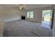 Spacious living room with a fireplace, ceiling fan and plenty of natural light at 152 Tulipfield Way, Benson, NC 27504