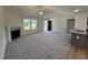 Spacious living room with a fireplace, ceiling fan and plenty of natural light at 152 Tulipfield Way, Benson, NC 27504