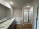The main bathroom features a large soaking tub, separate shower and granite countertops at 152 Tulipfield Way, Benson, NC 27504