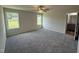 Large main bedroom features two windows, ceiling fan and ensuite bathroom at 152 Tulipfield Way, Benson, NC 27504