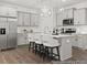 Modern kitchen with gray cabinetry, quartz countertops, island with bar seating, and stainless appliances at 157 N District Ave # 291, Clayton, NC 27527