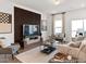 Inviting living room featuring neutral tones, ample seating, and a stylish accent wall for visual interest at 157 N District Ave # 291, Clayton, NC 27527
