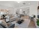 Spacious living area showcasing an open layout with modern furnishings and a seamless flow to the kitchen at 157 N District Ave # 291, Clayton, NC 27527