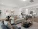 Spacious living area showcasing an open layout with modern furnishings and a seamless flow to the kitchen at 157 N District Ave # 291, Clayton, NC 27527