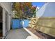 View of back yard patio with a wood and concrete patio with fenced yard at 1602 Township Cir, Raleigh, NC 27609