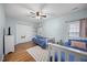 Bedroom with twin beds, hardwood floors, and ample natural light offers a cozy space at 1602 Township Cir, Raleigh, NC 27609