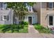 Inviting exterior showcasing the well-maintained landscaping and charming townhome facade at 1602 Township Cir, Raleigh, NC 27609