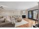 Living room with fireplace, comfortable seating, and wood floors offers a cozy atmosphere at 1602 Township Cir, Raleigh, NC 27609