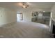 Bright living room featuring a fireplace, opening to the kitchen with sleek countertops and modern cabinets at 171 Tulipfield Way, Benson, NC 27504