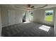Generously sized main bedroom with tray ceiling, ceiling fan, plush carpeting, and ensuite bathroom access at 171 Tulipfield Way, Benson, NC 27504