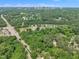 An aerial view of the city skyline with surrounding greenery, roads, and parking at 1717 Martin Luther King Jr Blvd, Raleigh, NC 27610
