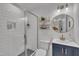 Modern bathroom with tiled shower, sleek vanity, gold accents, and contemporary fixtures at 1717 Martin Luther King Jr Blvd, Raleigh, NC 27610
