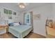 Serene bedroom with blue accents, wood floors, and soft lighting for a relaxing space at 1717 Martin Luther King Jr Blvd, Raleigh, NC 27610