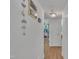 Bright hallway featuring modern decor and wood-look flooring, connecting various rooms in the home at 1717 Martin Luther King Jr Blvd, Raleigh, NC 27610