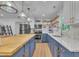 Well-equipped kitchen with stainless steel appliances, marble backsplash and open wood shelving at 1717 Martin Luther King Jr Blvd, Raleigh, NC 27610