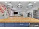 Open concept kitchen featuring an island with seating and a view into the living area at 1717 Martin Luther King Jr Blvd, Raleigh, NC 27610
