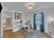 Functional home office with a built-in desk, ample storage, and natural light from the window at 1717 Martin Luther King Jr Blvd, Raleigh, NC 27610